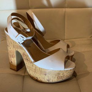 Platform white ankle strap sandals.